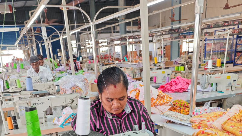 Worker in ethical kids clothing factory