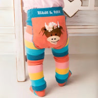Colorful striped leggings with a cartoon cow design and 'Blade & Rose' branding.
