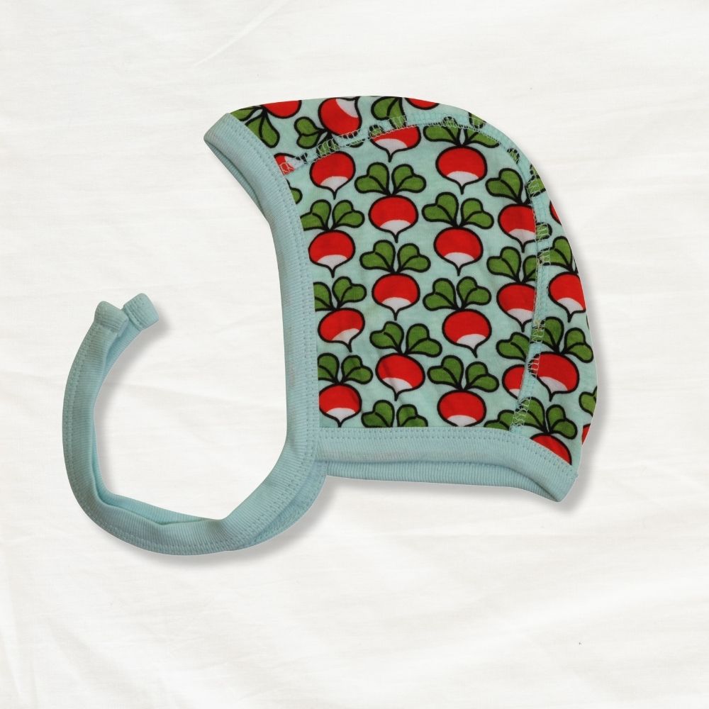 Baby bonnet with radish pattern on a white background
