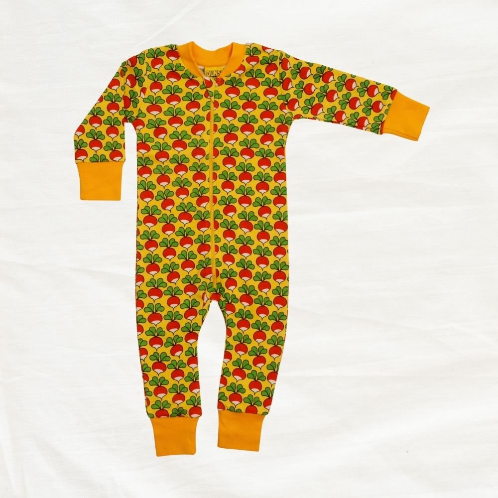 Children's onesie with red and green pattern on a white background