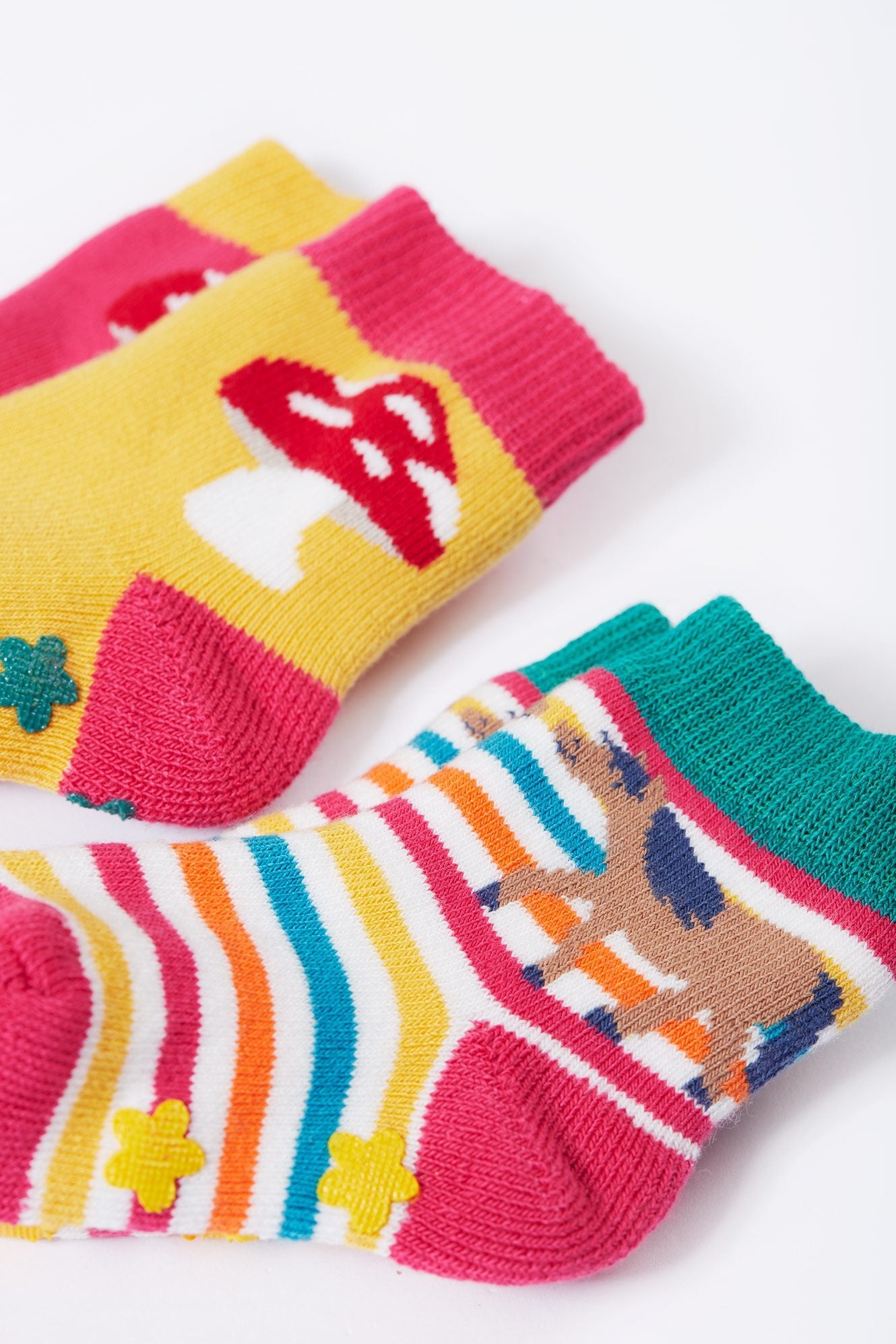 Colorful children's socks with animal designs on a white background