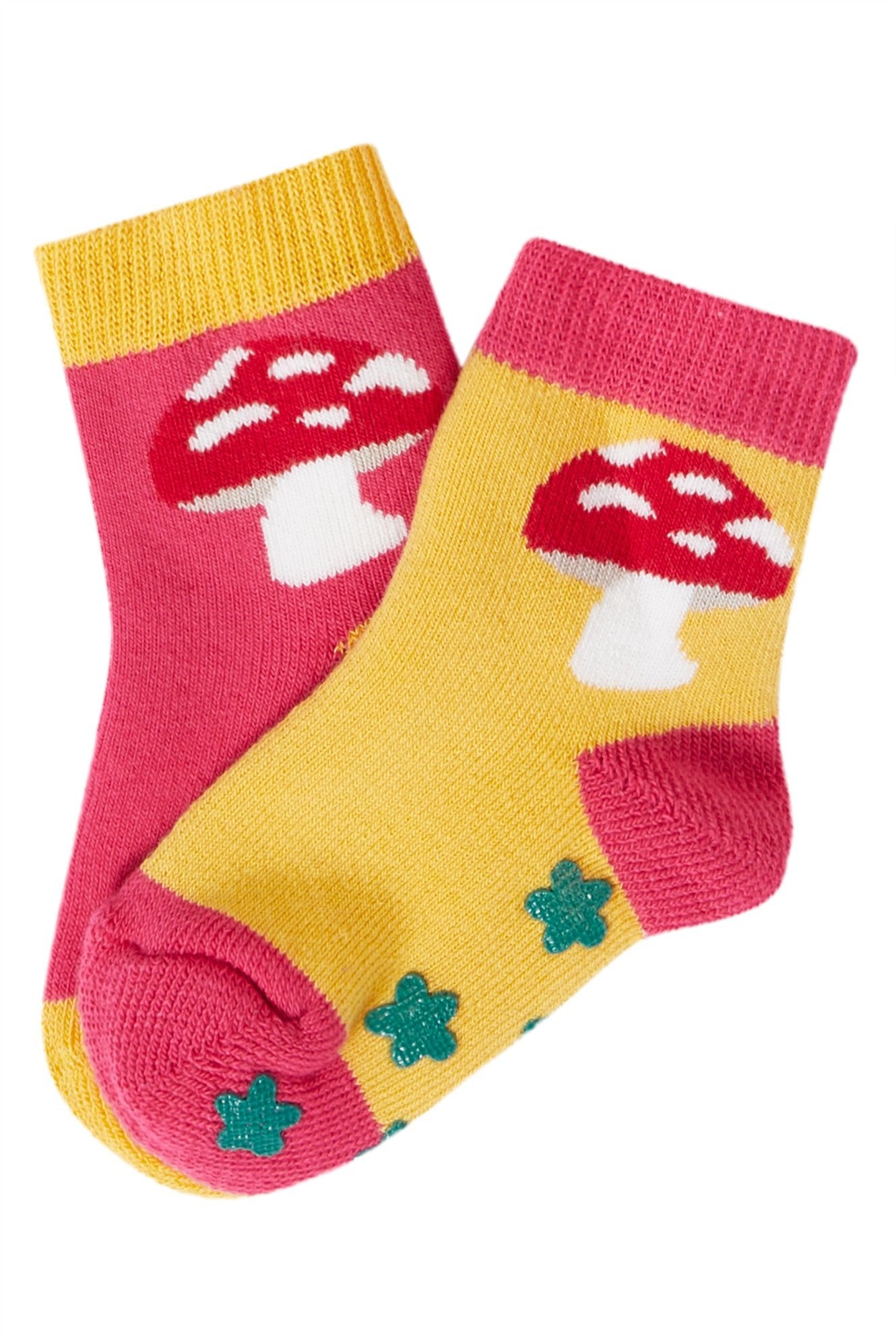 Pair of children's socks with mushroom design on a white background