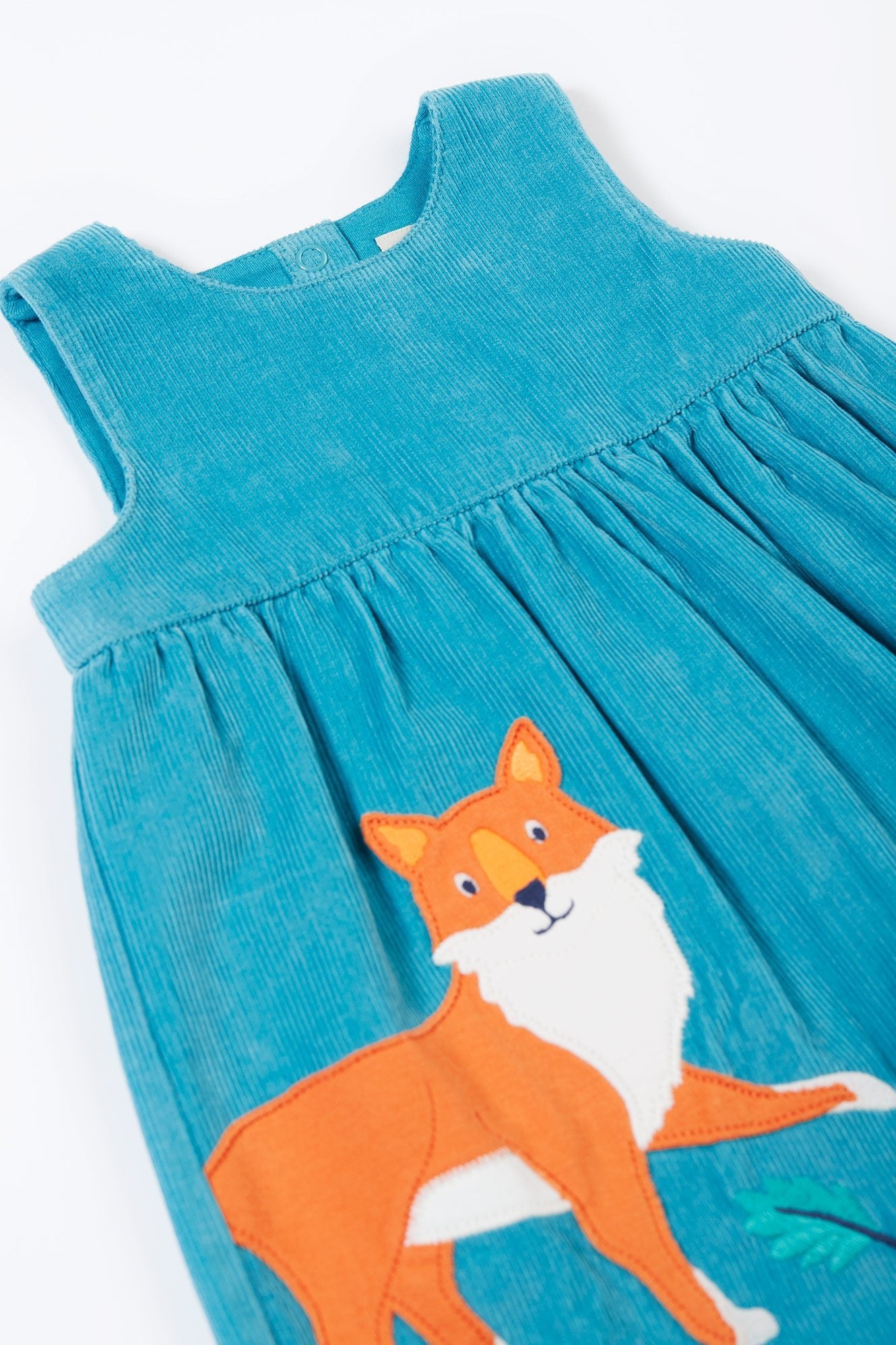 Blue dress with a fox design on a white background