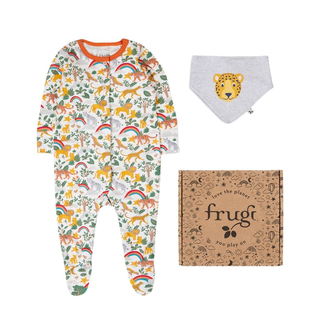 Children's onesie with animal pattern, bib, and frugi packaging on a white background