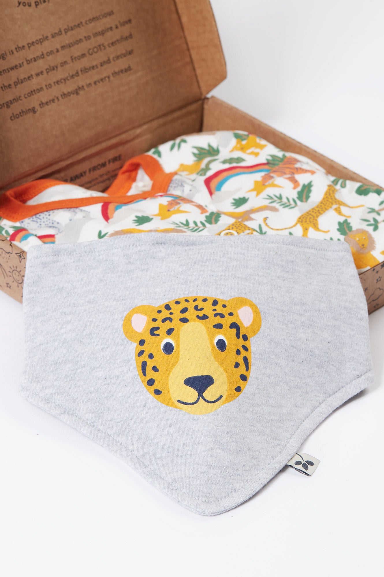 Gray baby bib with a leopard design on a white background