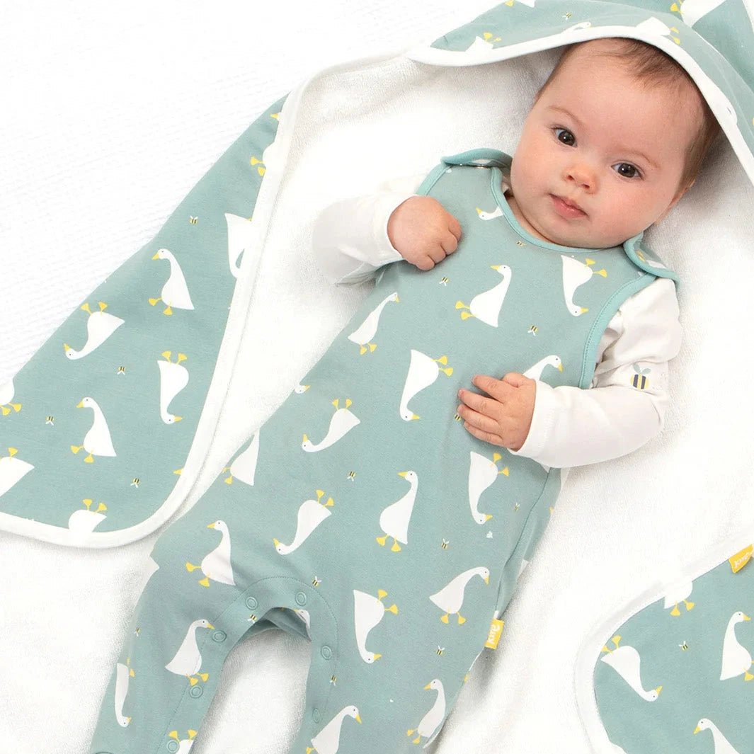 Baby wearing Kite Organic Little Goose Dungaree Set with Hat