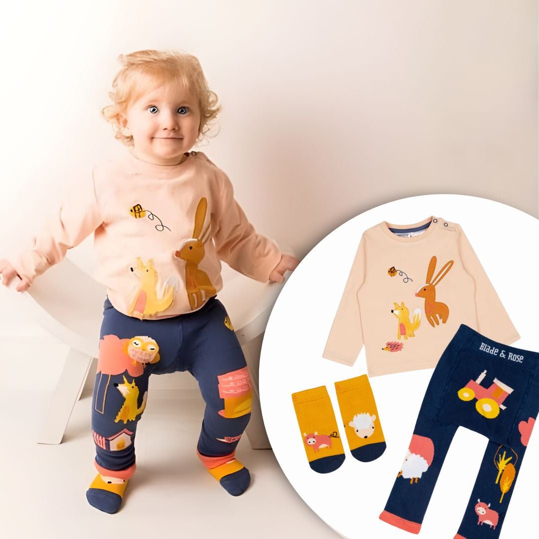 Child wearing a outfit with animal prints, including a shirt, leggings, and socks, on a light background.