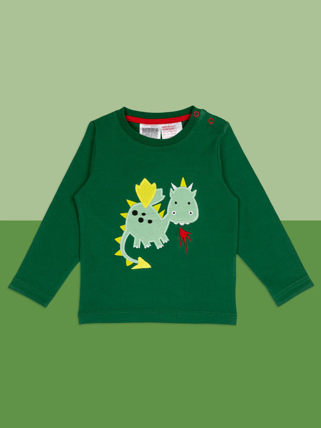 Green long-sleeve shirt with dinosaur design on a green background