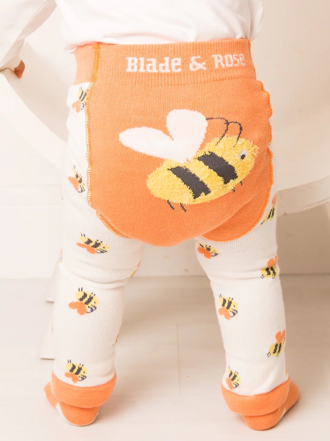 Baby leggings with bee design and orange waistband featuring 'Blade & Rose' brand.