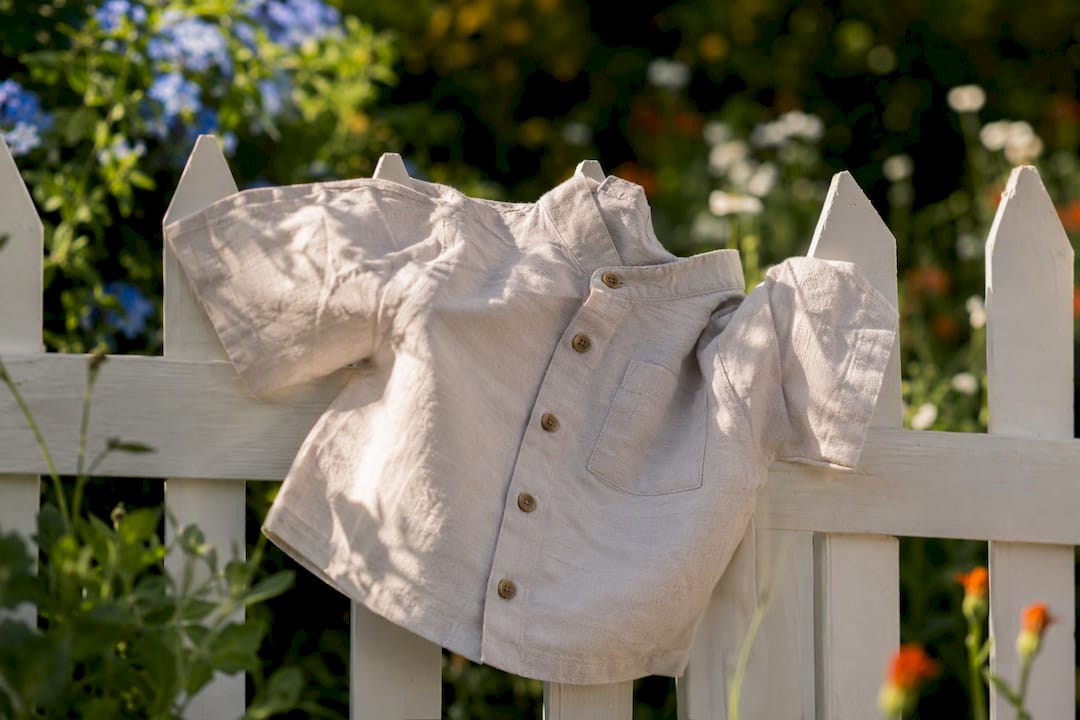 Close-up of linen toddler shirt on fence