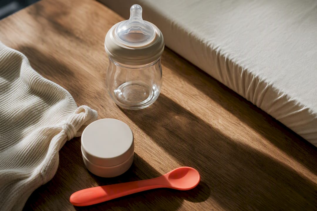 Organic baby essentials arranged in warm editorial light