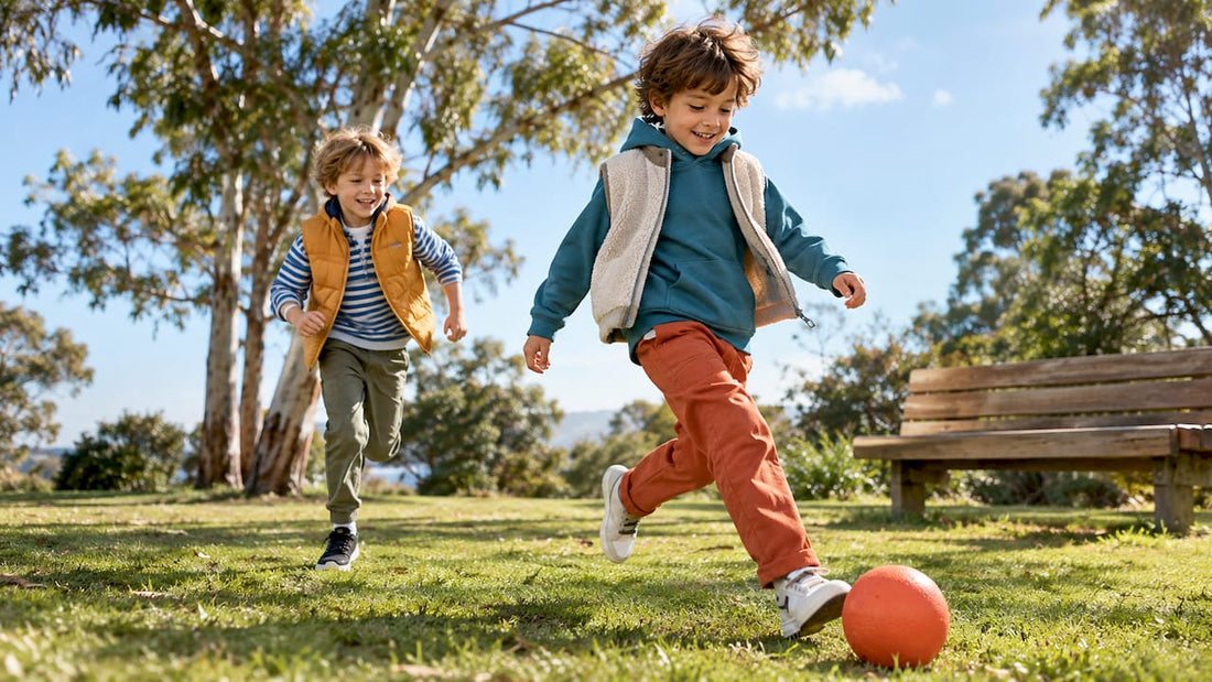 Boys playing outdoors in colourful outfits