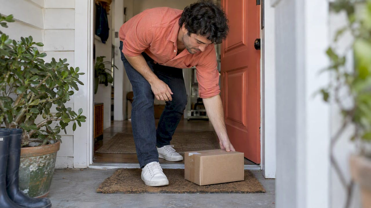 Parent collecting a baby clothes parcel