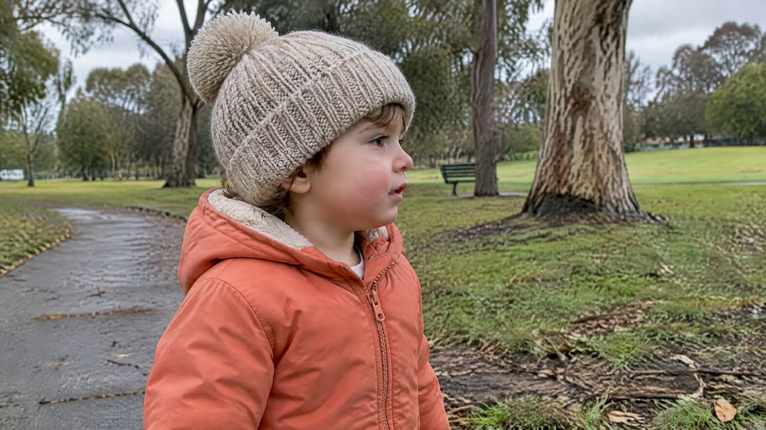 Toddler wearing a cord-free winter hat outdoors