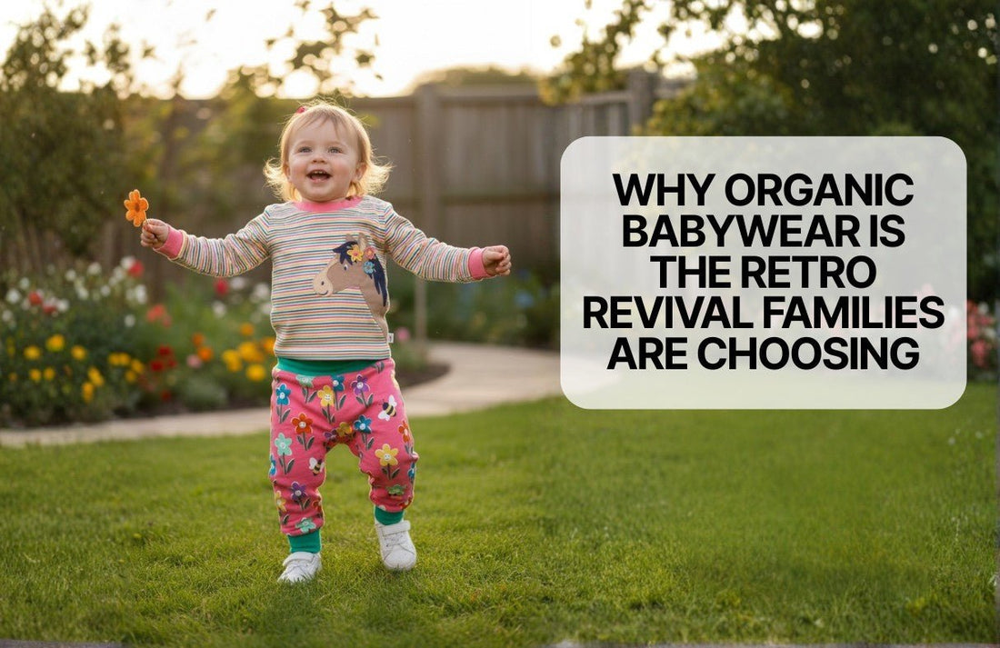 Smiling toddler in organic retro babywear with floral and horse patterns playing outdoors on green lawn