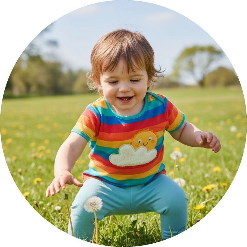 Baby wearing rainbow cloud t-shirt form frugi