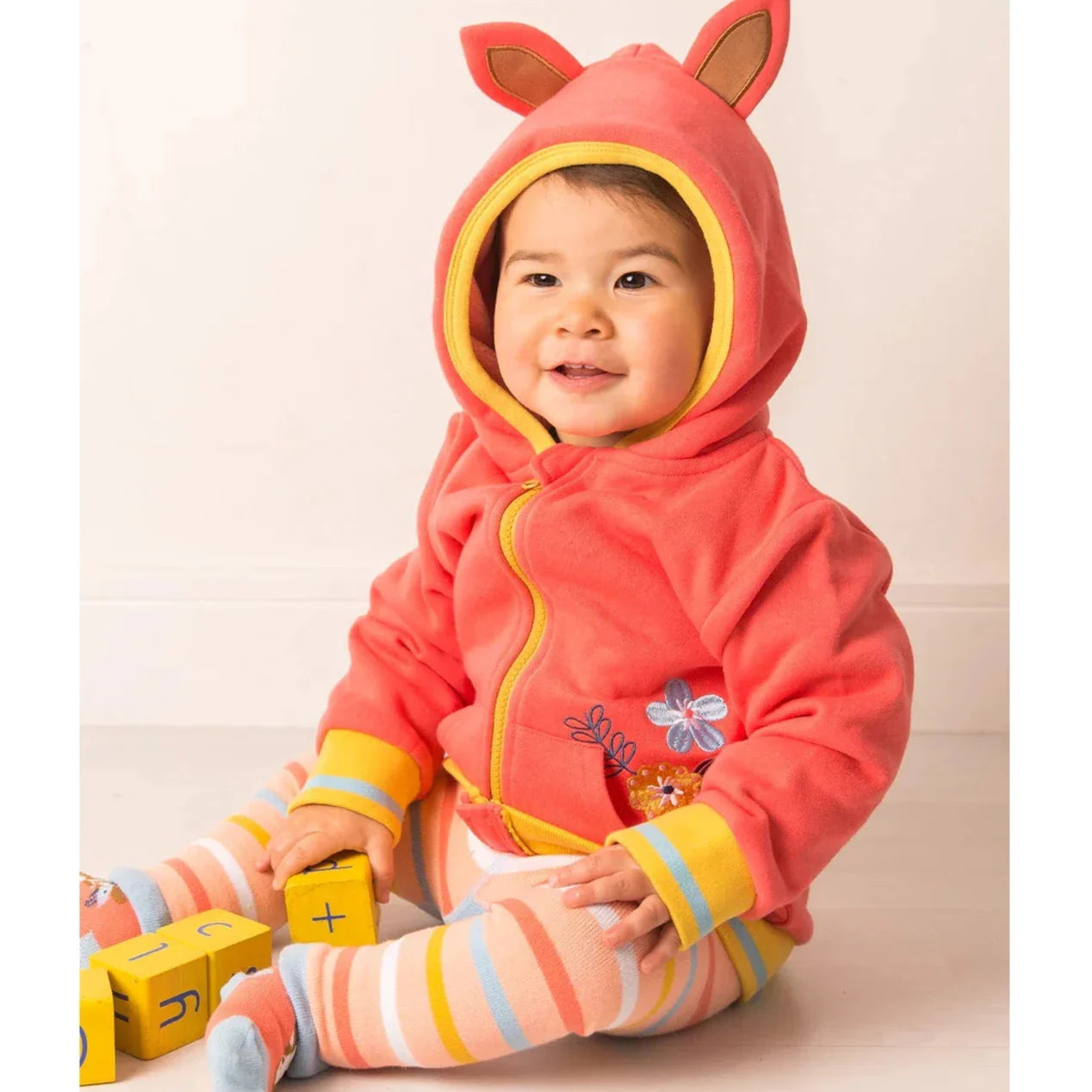 Toddler in pink gift bundle