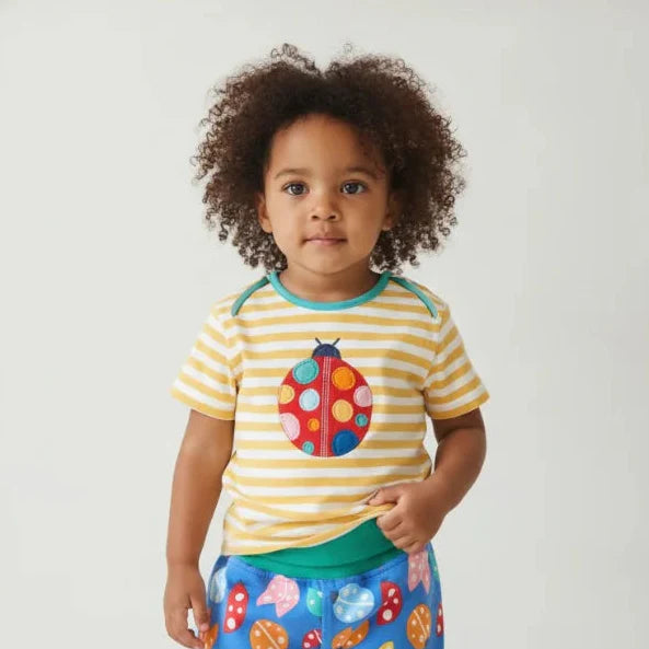 Toddler girl wearing bright organic clothes