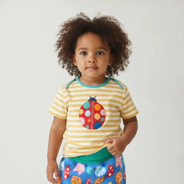 Toddler girl wearing bright organic clothes