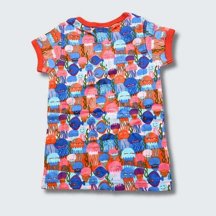 Colorful children's top with jelly fish pattern on a light gray background