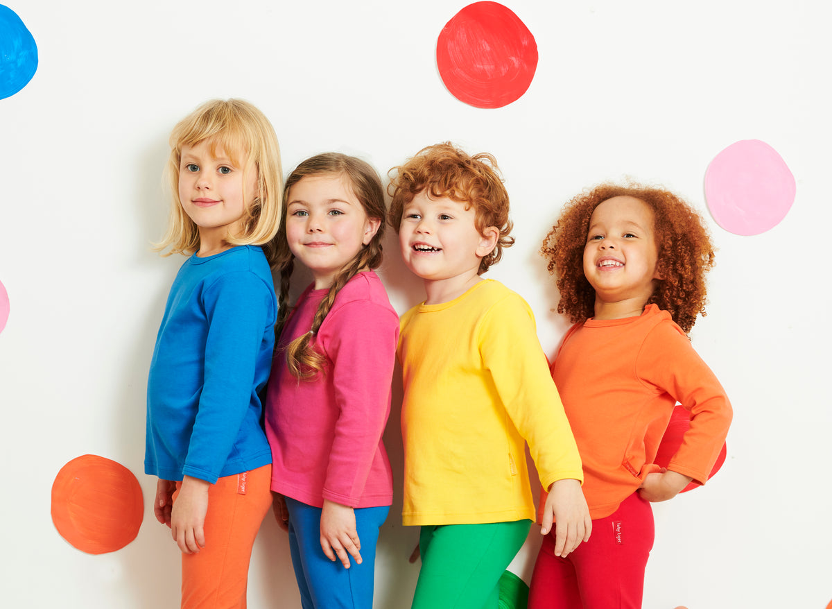 groups of kids in bright block colour organic clothes