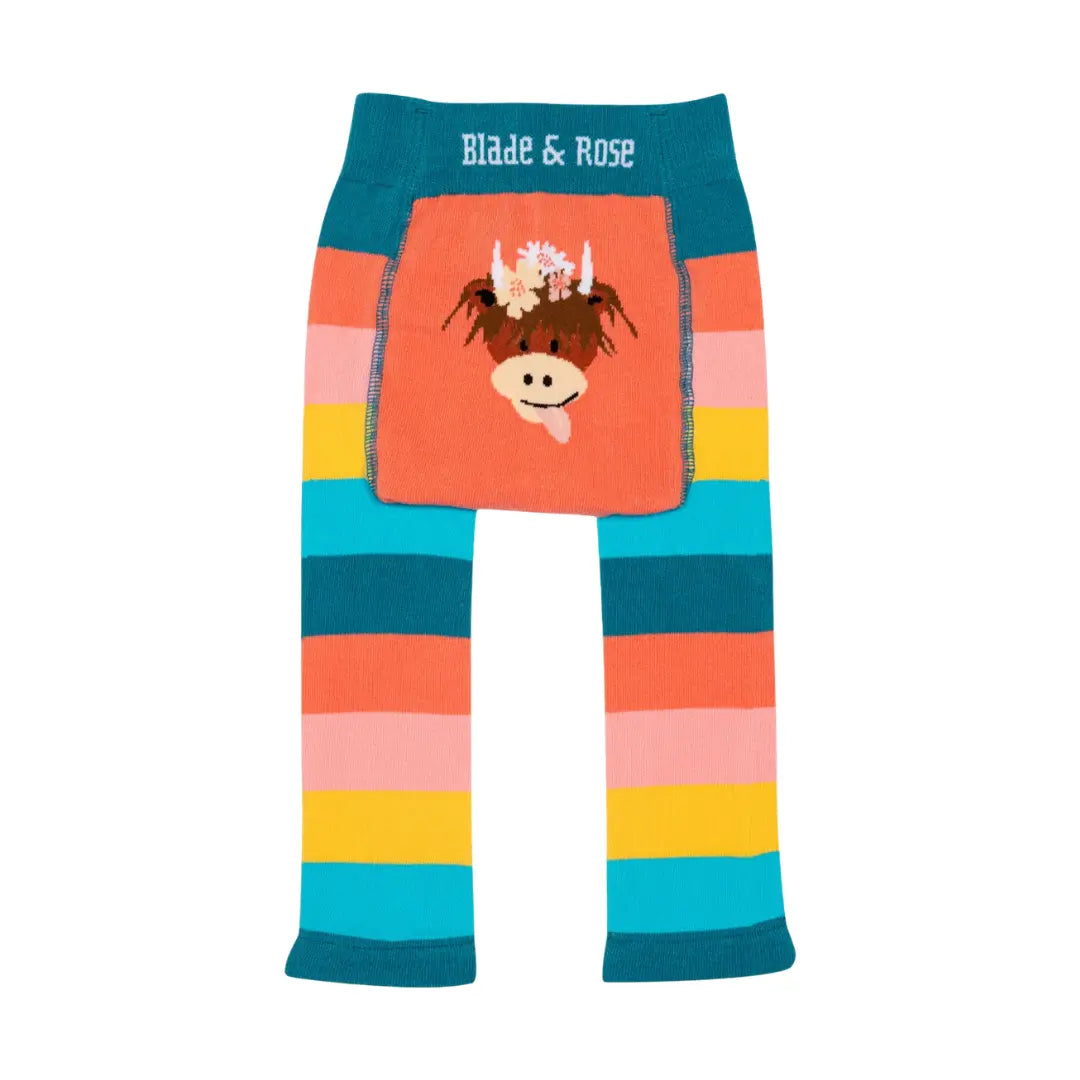 A pair of children's leggings by Blade & Rose, featuring a colorful striped pattern in teal, orange, pink, yellow, and light blue, with a central pocket displaying a cow applique.