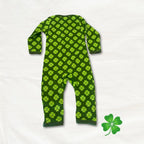 Green baby onesie with clover pattern on a white background