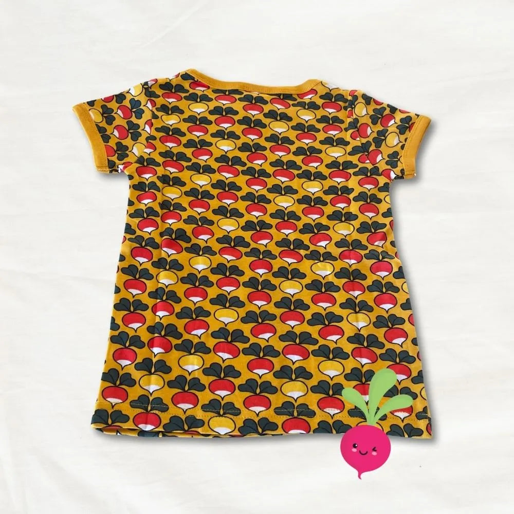 Yellow dress with red and black pattern on a white background