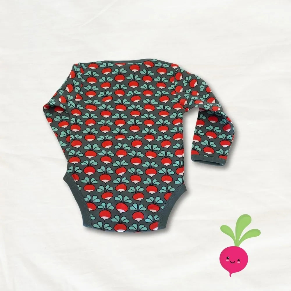 Baby onesie with red and green pattern on a white background