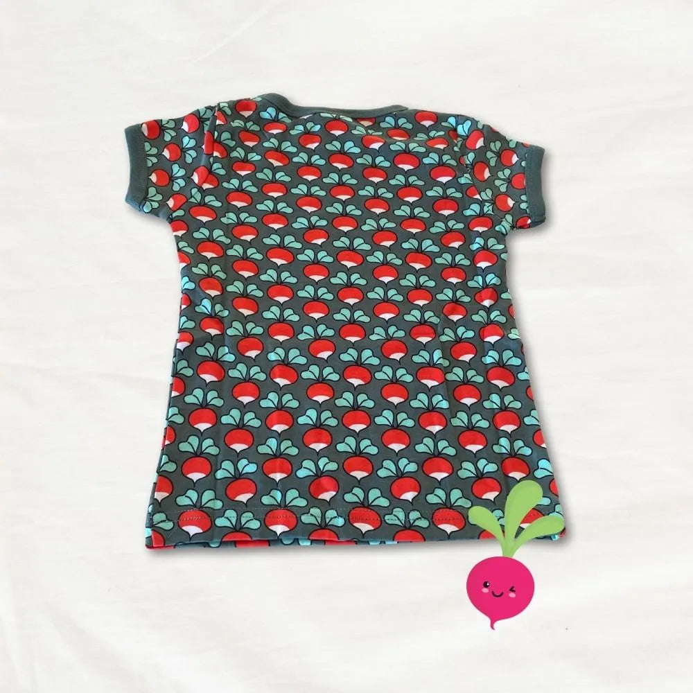 Children's t-shirt with red and green pattern on a white background