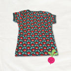 Children's t-shirt with red and green pattern on a white background