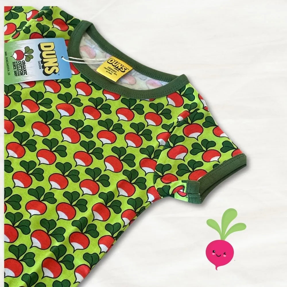 Green baby romper with red and white pattern on a white background