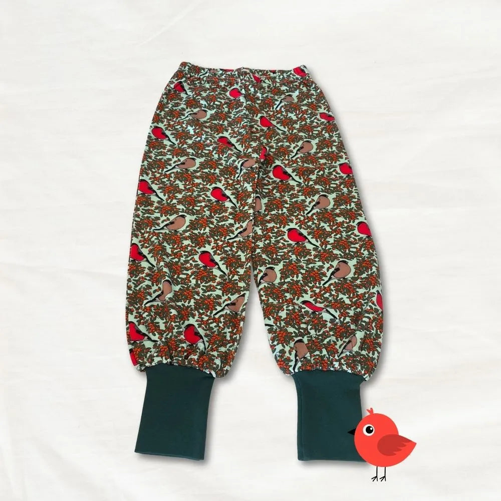 Children's harem pants with bird pattern on a white background