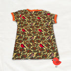 T-shirt dress with bird and berry pattern on a white background