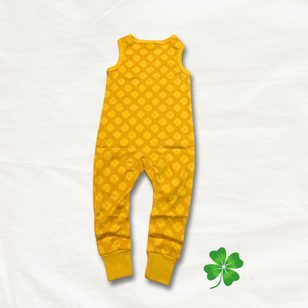 Yellow sleeveless dungaree with a pattern on a light gray background