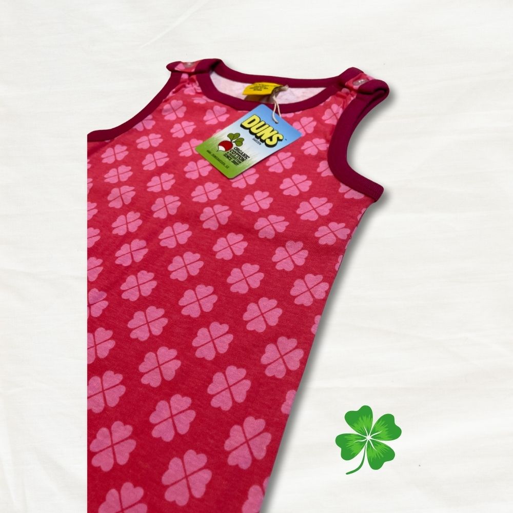 Red tank top with pink clover pattern on a white background