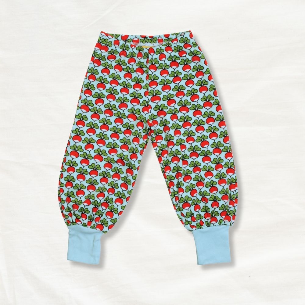 Children's pants with radish pattern on a white background