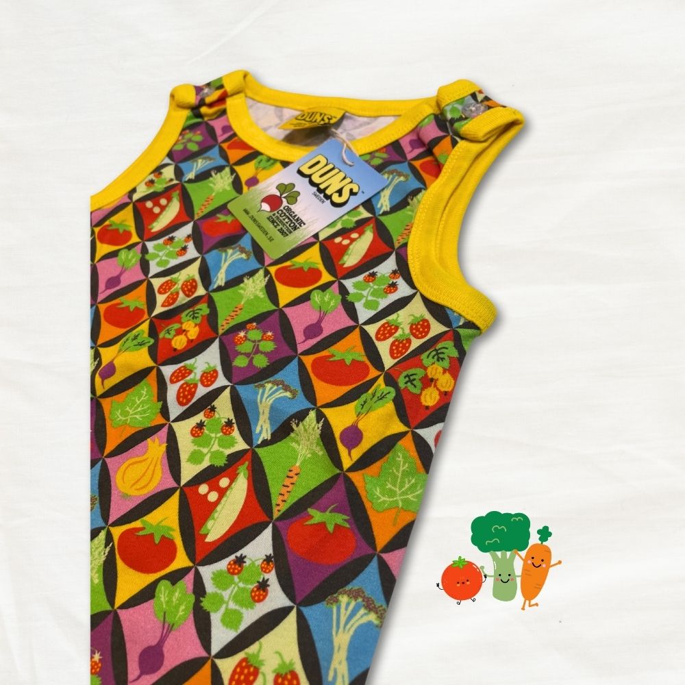 Children's sleeveless top with colorful vegetable pattern on a white background