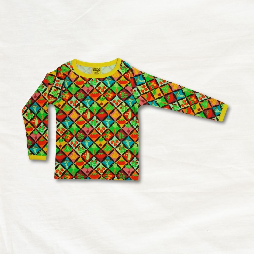 Colorful geometric patterned shirt on a white background
