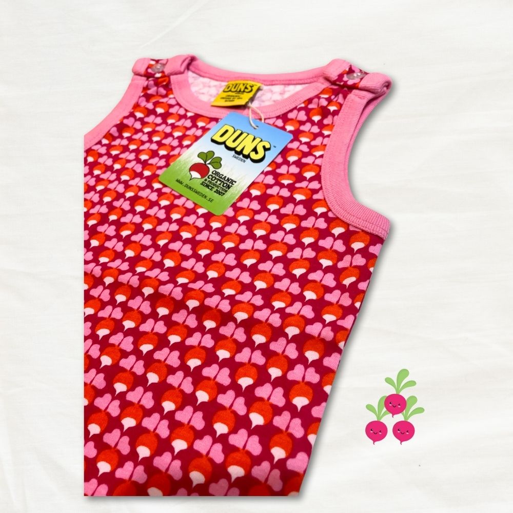 Pink dungarees with radish pattern and Duns brand tag on a white background