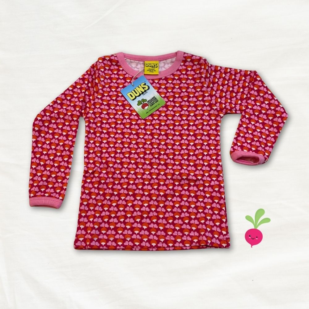 Pink long-sleeve shirt with a pattern on a white background, featuring a Duns brand tag.