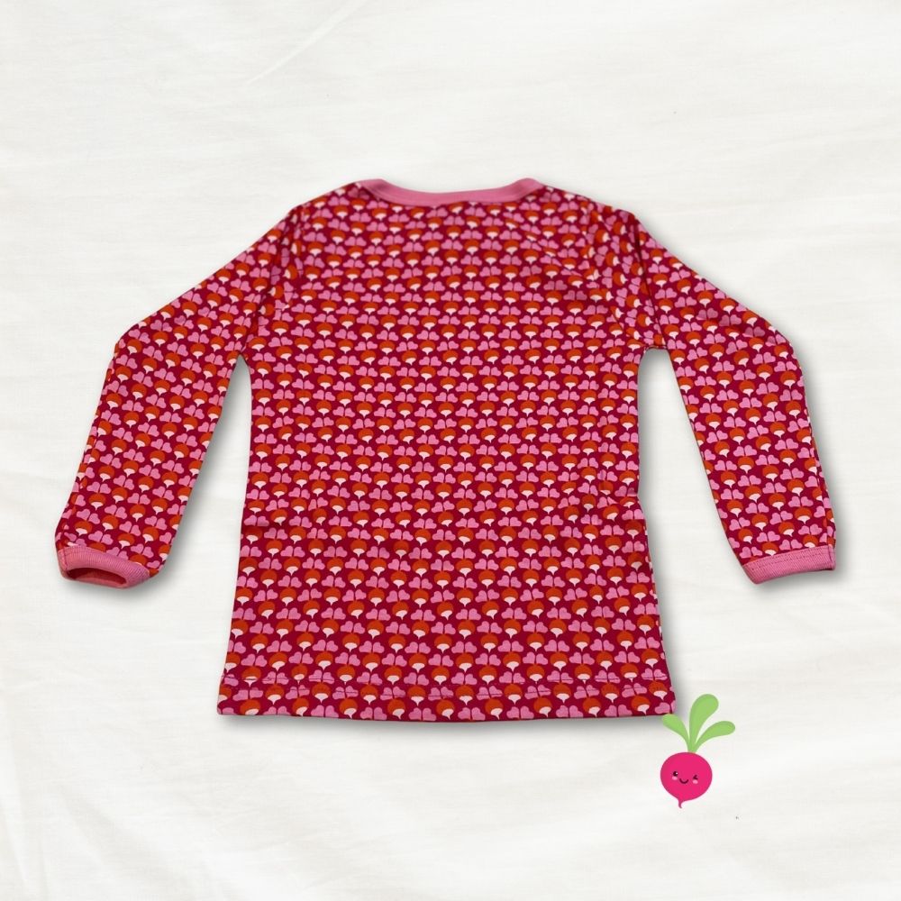 Pink long-sleeve shirt with a  radish pattern on a white background