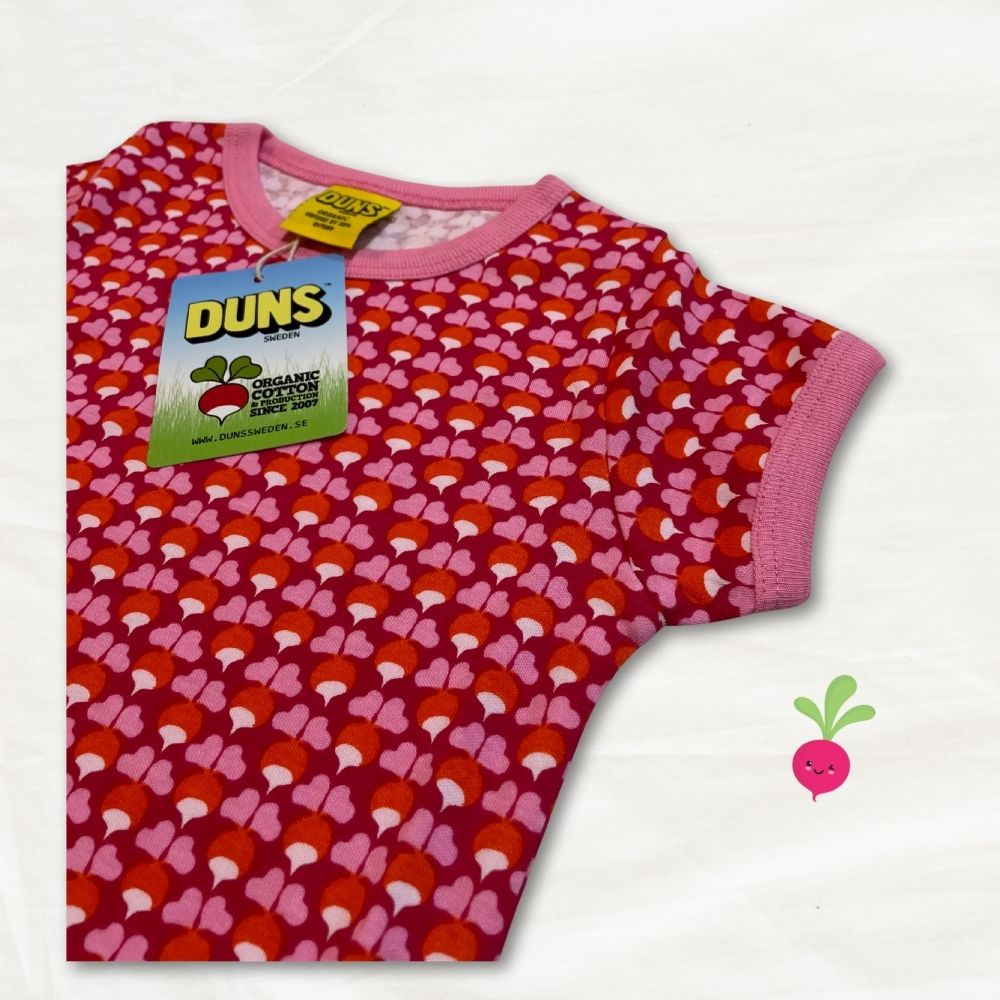 Children's t-shirt with red and pink radish pattern and DUNS tag on a white background