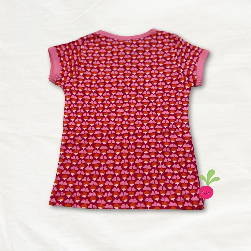 Pink shirt with a radish pattern on a white background