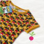 Children's underwear with a colorful mushroom pattern on a yellow background, featuring the brand 'Duns'.