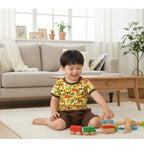 Child playing with wooden toys in a living room