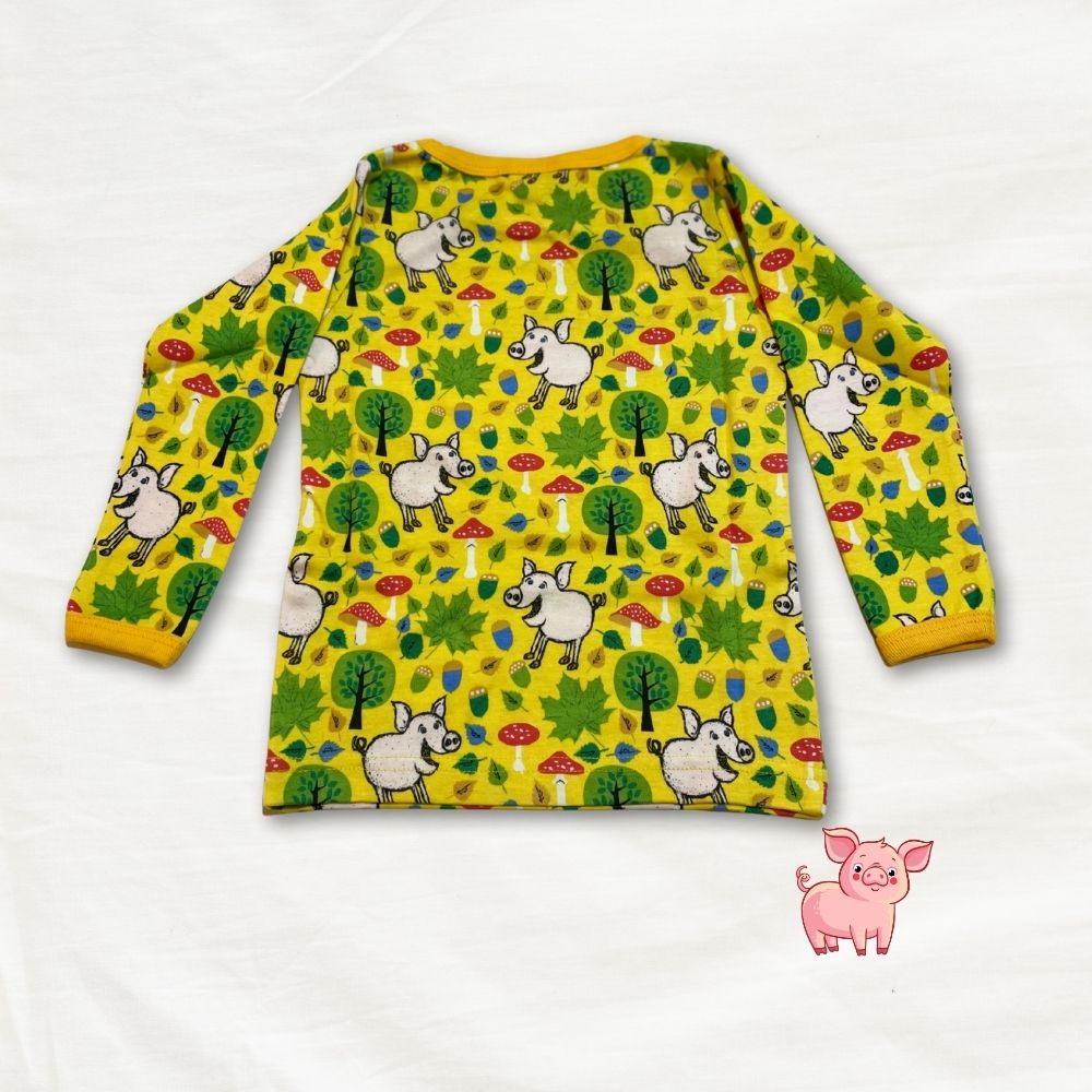 Yellow long-sleeve shirt with animal pattern on a white background