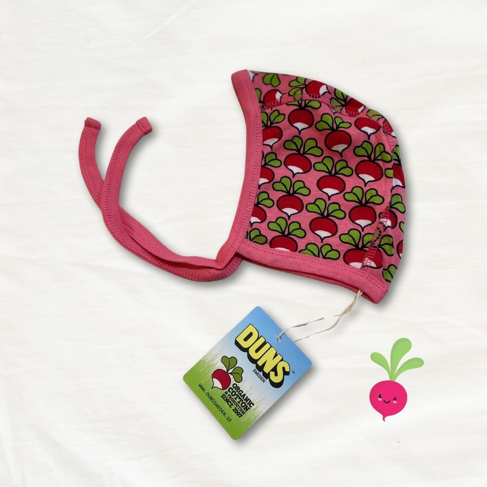 Pink baby hat with radish pattern and Duns brand tag on a white background