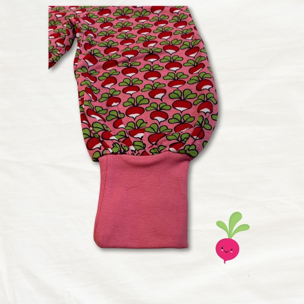 Pink baggy pants with radish pattern on a white background