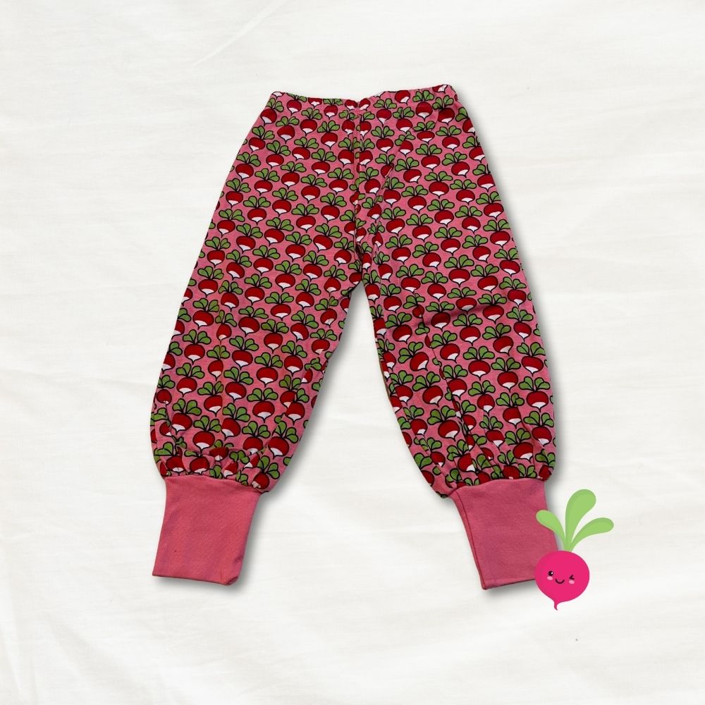 Children's pants with radish pattern on a white background